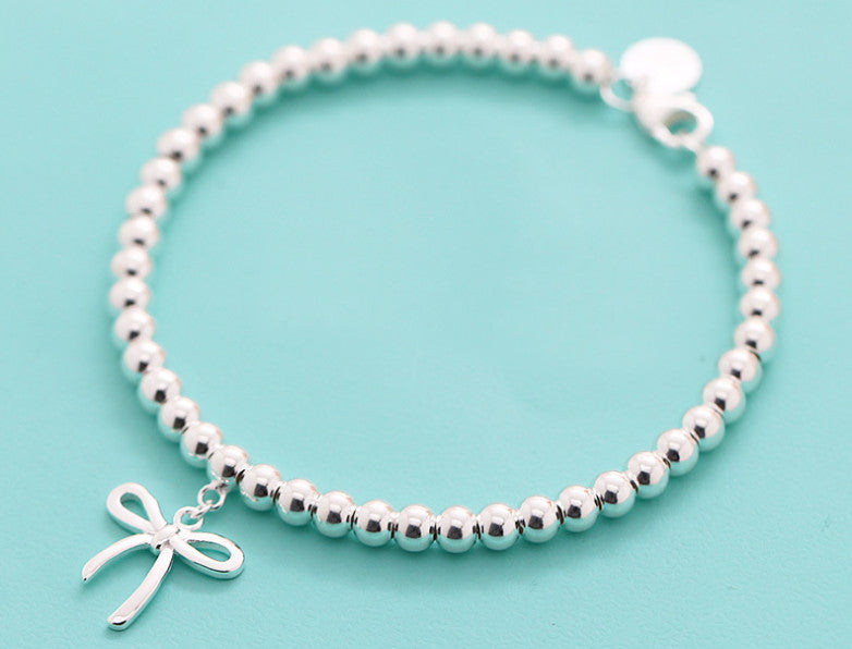 Bracelet with a Bow Charm in Solid Sterling Silver