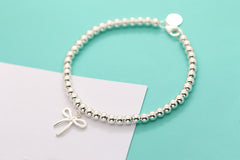 Bracelet with a Bow Charm in Solid Sterling Silver